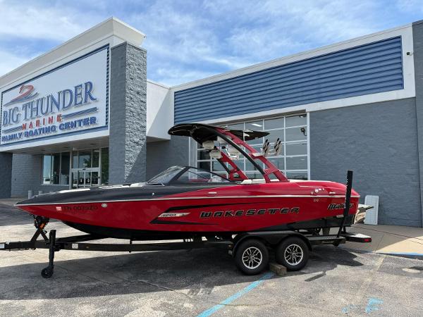 Malibu Wakesetter 22 MXZ 2015 Malibu Wakesetter 22 MXZ boat on trailer outside Big Thunder Marine.