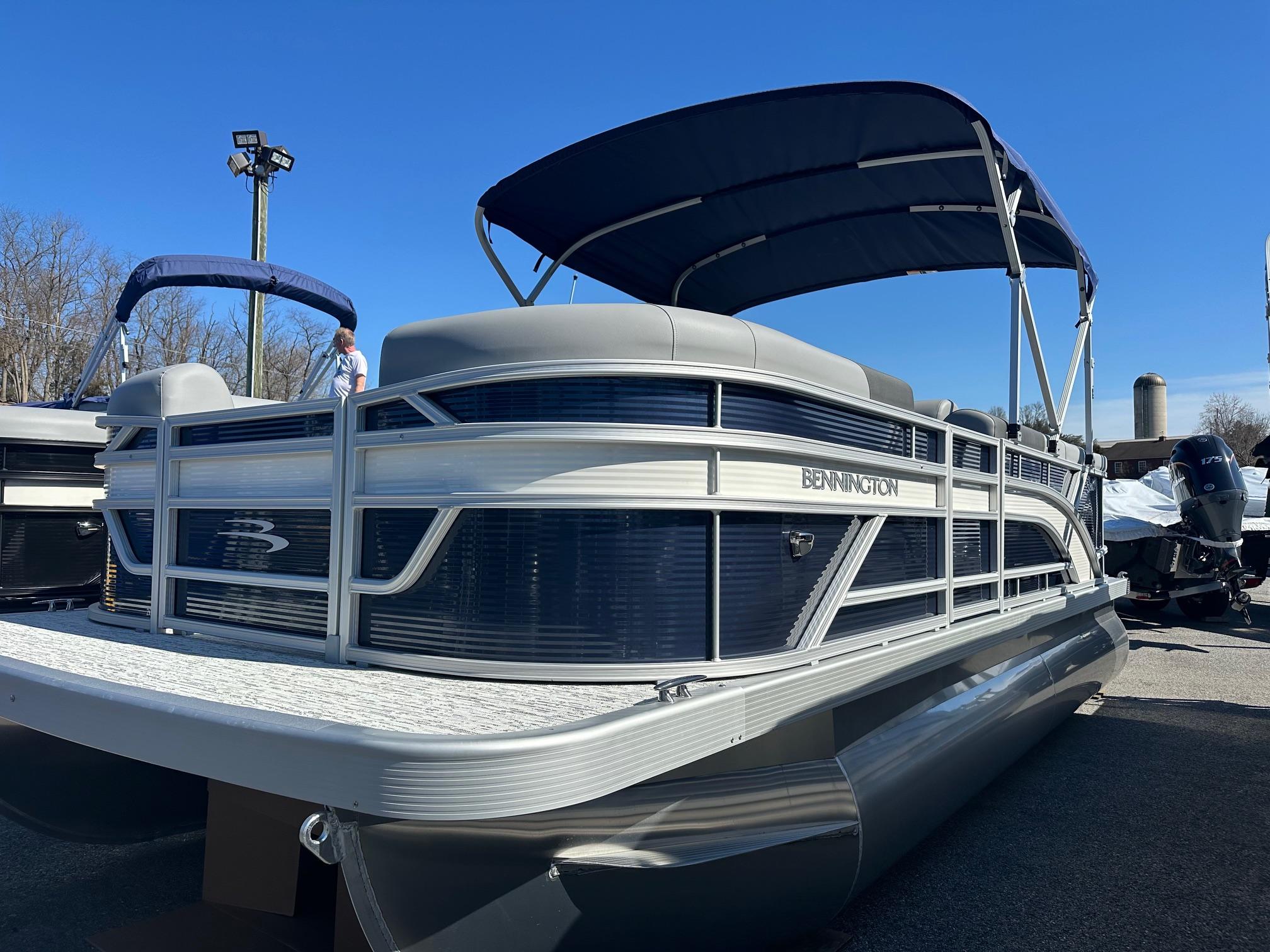 Bennington 20 SL Family with Privacy Room (In Stock) 2025 Bennington 20 SL Family pontoon boat with privacy room, in stock, under blue sky.
