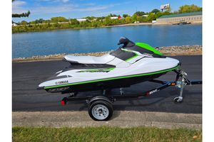 Yamaha WaveRunner EX 2017 Yamaha WaveRunner EX on trailer by a scenic lake.