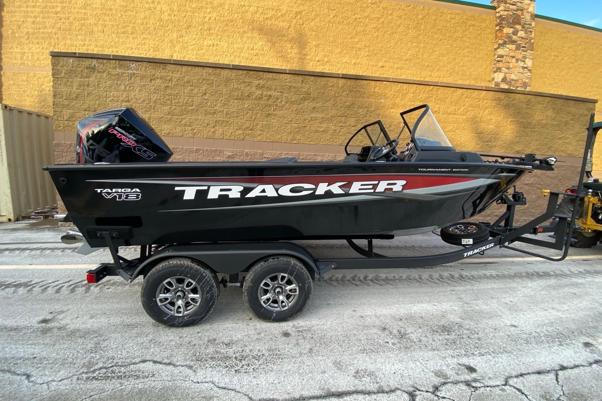 Tracker Targa V-18 Combo 2026 Tracker Targa V-18 Combo boat on trailer, black exterior, parked outdoors.