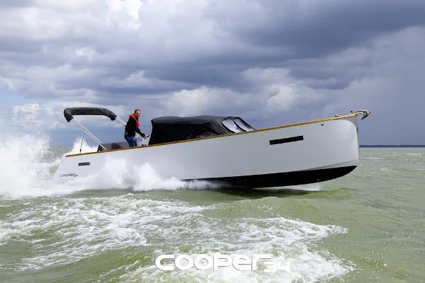 Cooper 34 2025 Cooper 34 boat cruising on choppy waters under cloudy skies.
