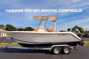 Cobia 220 Center Console 2023 Cobia 220 Center Console boat with Yamaha 200 HP engine on trailer.