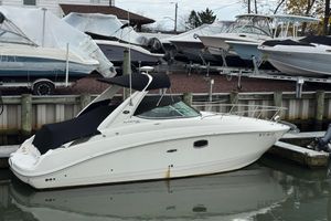 Sea Ray 280 Sundancer 2013 Sea Ray 280 Sundancer docked at marina with other boats.