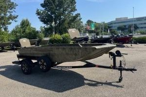 Tracker Grizzly 1650 T Prairie Wings Edition 2026 Tracker Grizzly 1650 T Prairie Wings Edition boat on trailer in outdoor setting.