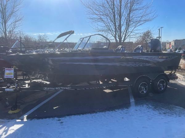 Ranger VX1988 WT 2024 Ranger VX1988 WT boat on trailer in snowy parking lot.