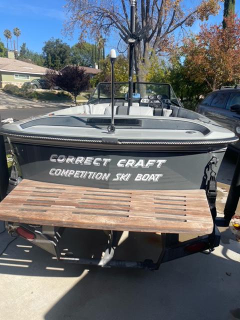 Correct Craft Ski Nautique 1987 Correct Craft Ski Nautique 2001 competition ski boat in driveway.