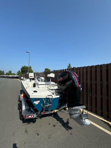 Ranger RB200 2024 Ranger RB200 boat on trailer with powerful outboard motor, parked on sunny day.
