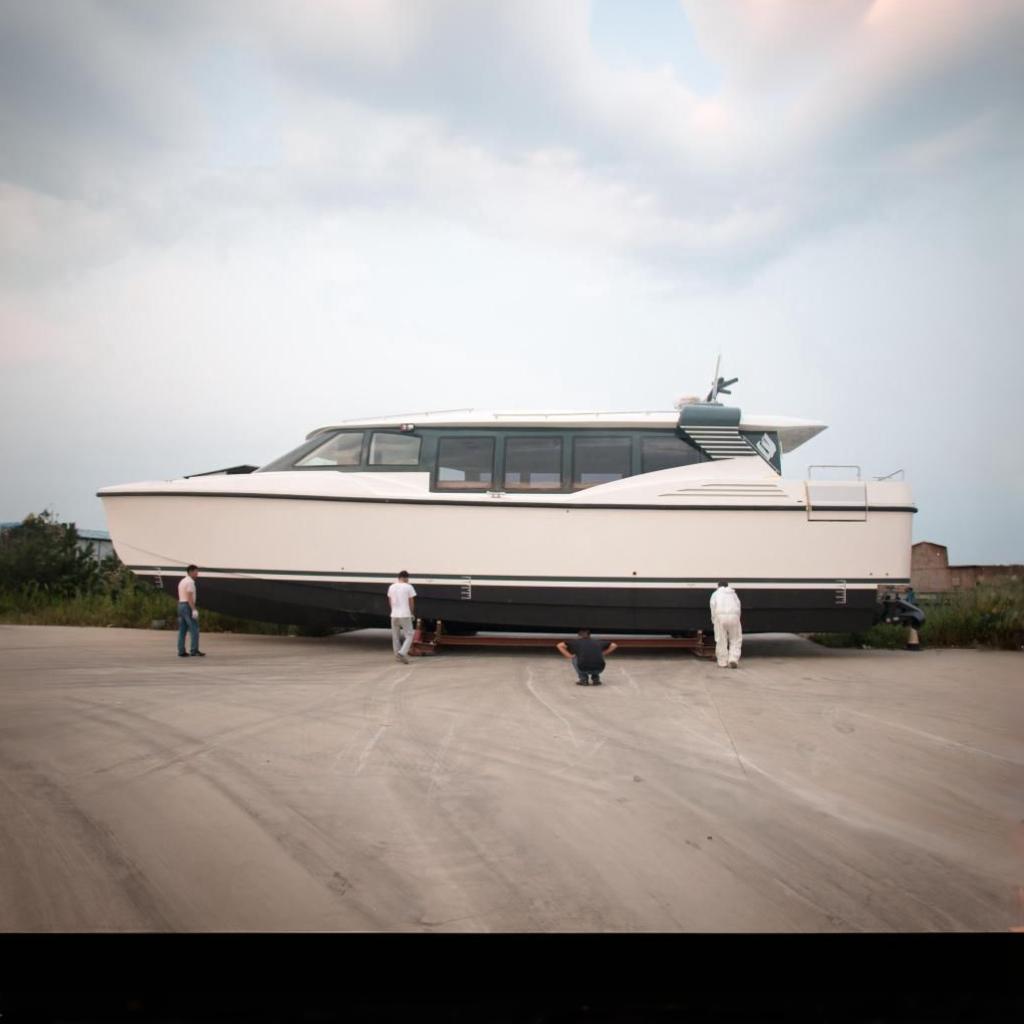 Mazarin Catamaran HSF-58 2025 Mazarin Catamaran HSF-58 on land with people inspecting it.
