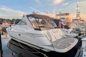 Cruisers Yachts 3870 Express 2000 Cruisers Yachts 3870 Express docked at marina during sunset.
