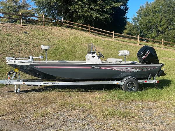 Ranger RB190 2024 Ranger RB190 boat on trailer, parked on grassy area.