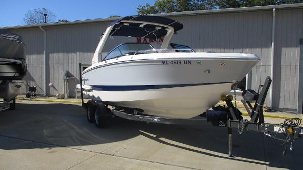 Chaparral 267 SSX 2021 Chaparral 267 SSX boat on trailer, parked outdoors.