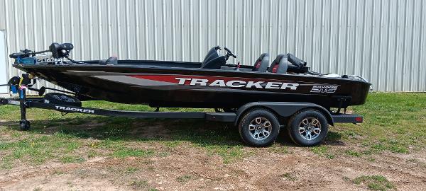 Tracker Savage 215 2025 Tracker Savage 215 boat on trailer, parked outdoors.