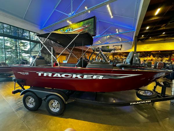 Tracker Pro Guide V-175 Combo 2025 Tracker Pro Guide V-175 Combo boat displayed indoors with vibrant lighting.