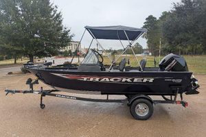Tracker Pro Guide V-16 WT 2026 Tracker Pro Guide V-16 WT boat on trailer, parked outdoors.