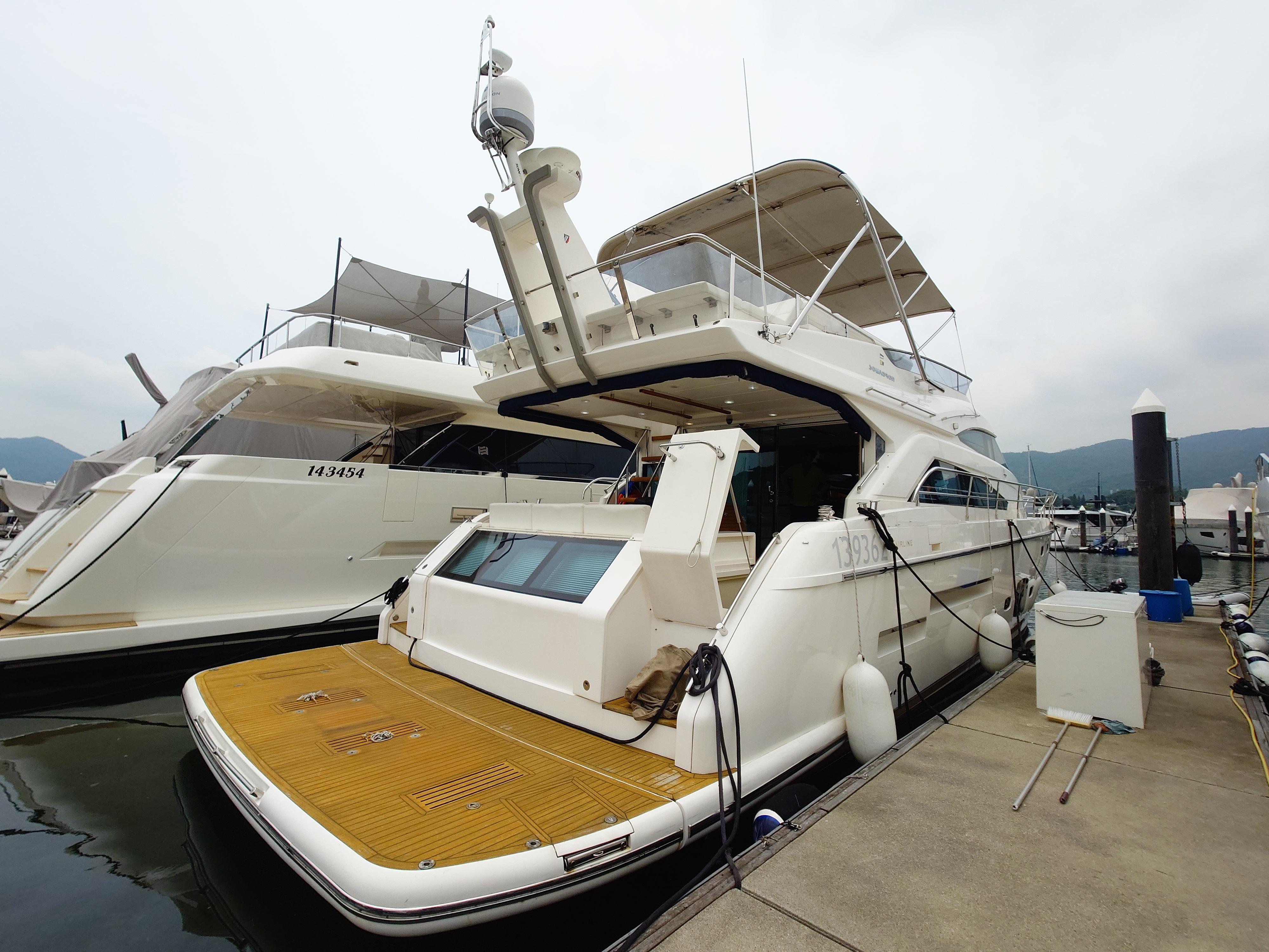 Fairline 65 Luxury 2010 Fairline 65 yacht docked at marina, showcasing elegant design and spacious deck.