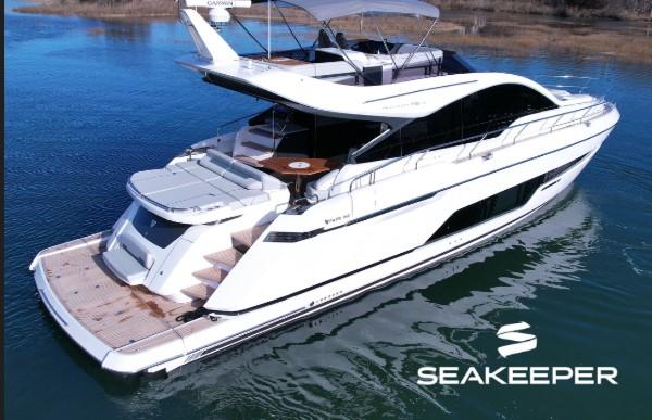 Fairline Phantom 65 2024 Fairline Phantom 65 luxury yacht on water, Seakeeper logo.