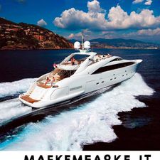 ISA 120 Luxurious 2005 ISA 120 yacht cruising on open sea with scenic coastal backdrop.