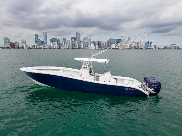 Yellowfin 36 2008 Yellowfin 36 boat on water with city skyline in background.