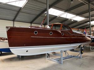 Rapsody 29 Ft. OC Classic 2001 Rapsody 29 Ft. OC wooden boat displayed indoors.
