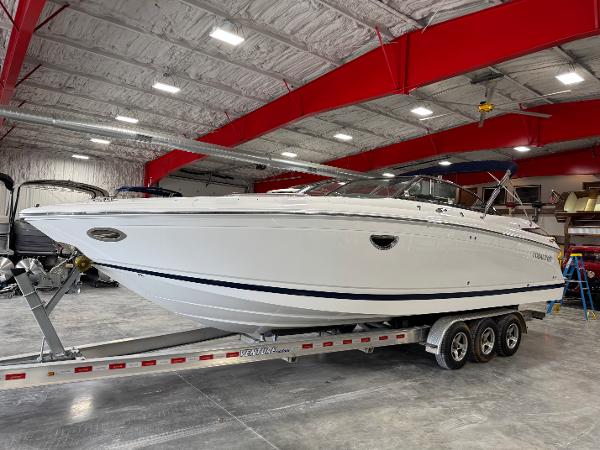Cobalt 302 BR 2009 Cobalt 302 BR boat on trailer in spacious indoor storage facility.