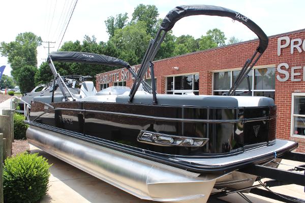 Tahoe Pontoon Cascade Quad Lounger 2025 Tahoe Pontoon Cascade Quad Lounger, black exterior, parked near a brick building.