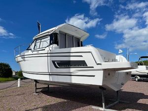 Jeanneau Merry Fisher 795 Serie 2 2024 Jeanneau Merry Fisher 795 s2 boat displayed outdoors under a blue sky.