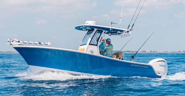 Sportsman Open 212 Center Console 2025 Sportsman Open 212 boat cruising on open water, featuring fishing rods and Yamaha engine.