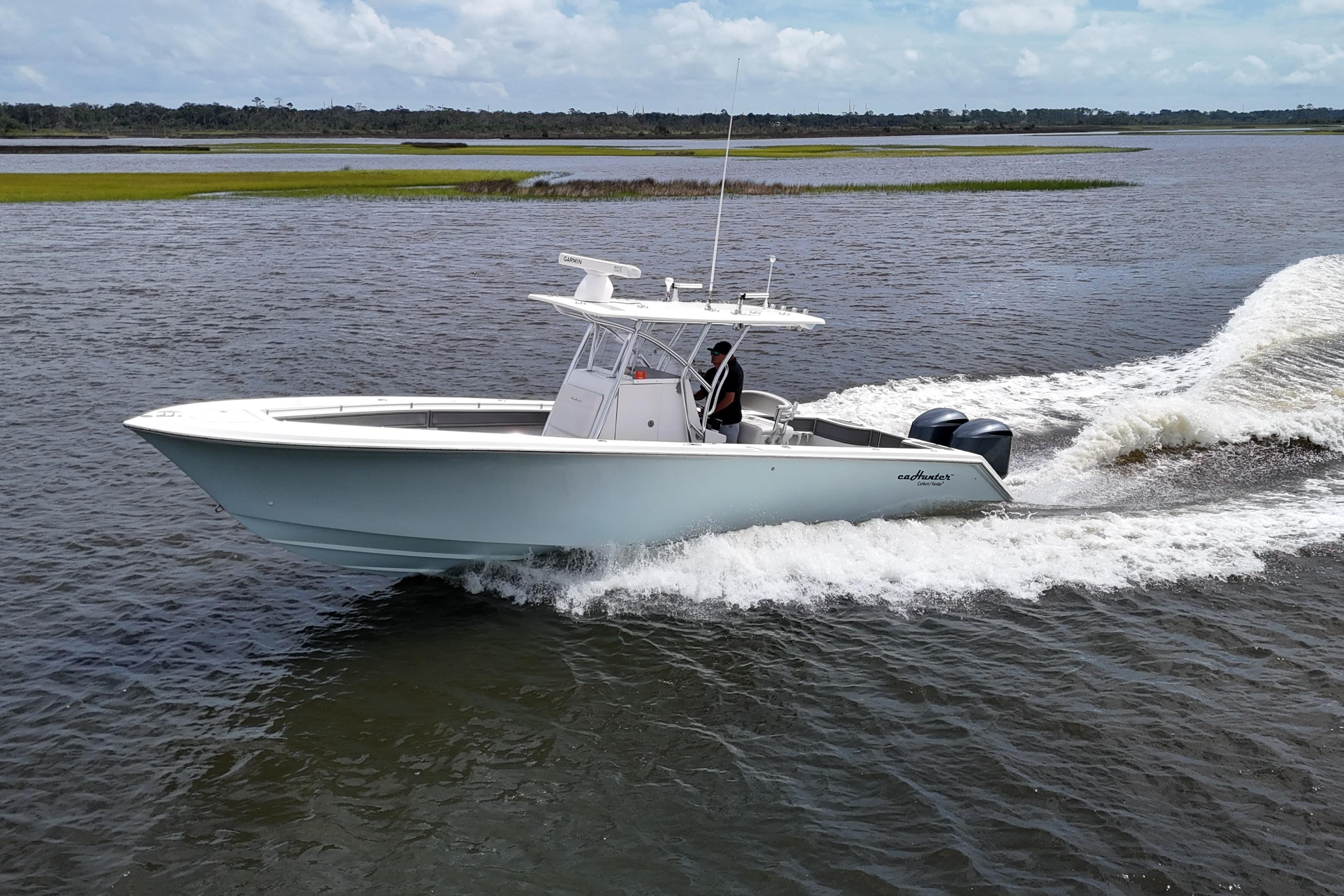 SeaHunter 33 Tournament 2013 SeaHunter 33 Tournament boat cruising on open water.