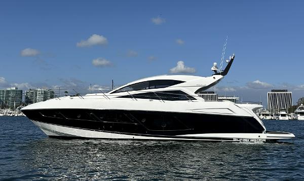 Sunseeker Predator 57 2015 Sunseeker Predator 57 yacht on water, sleek design, clear sky background.