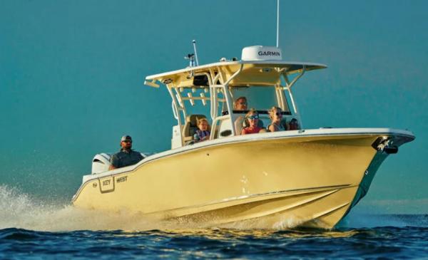 Key West 291 FS 2025 Key West 291FS boat cruising on open water with passengers.