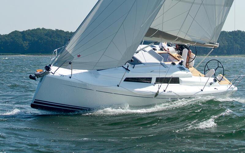 Hanse 315 2016 Hanse 315 sailboat navigating through water with sails unfurled, showcasing sleek design.