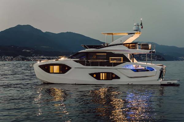 Absolute 52 FLY Luxurious 2026 Absolute 52 FLY yacht on serene water at dusk.