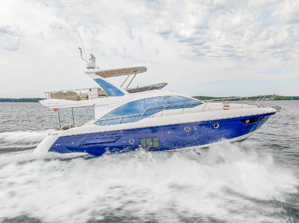Azimut 50 Flybridge Azimut 50 Flybridge 2018 yacht cruising on open water, side view.