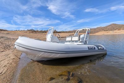 Tide Craft Beaver 10 2025 Tide Craft Beaver 10 boat on a serene lake with clear blue skies. Boat