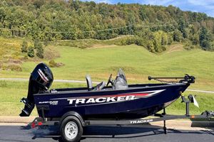 Tracker Super Guide V-16 SC 2026 Tracker Super Guide V-16 SC boat on trailer, scenic background.