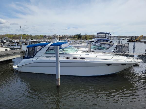 Sea Ray 370 Sundancer 1995 Sea Ray 370 Sundancer yacht docked in a marina under a cloudy sky.
