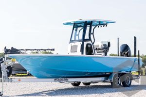 Tidewater 2410 Bay Max 2026 Tidewater 2410 Bay Max boat on trailer, vibrant blue hull, outdoor setting.
