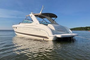 Formula 400 Super Sport 2001 Formula 400ss boat anchored in calm waters under clear blue sky.