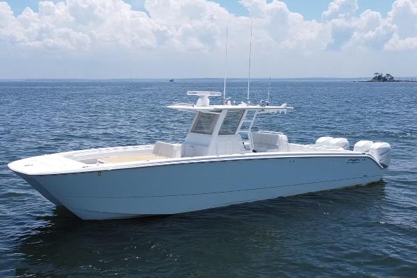 Invincible 40 Catamaran 2019 Invincible 40 Catamaran on calm ocean waters under a partly cloudy sky.