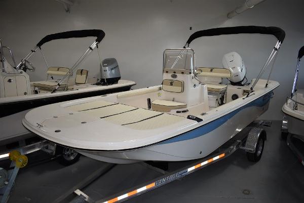 Carolina Skiff 19 LS 2023 Carolina Skiff 19 LS boat on trailer in showroom.