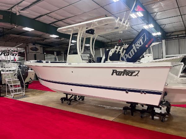 Parker 2600 Center Console 2025 Parker 2600 Center Console boat displayed indoors on red carpet.