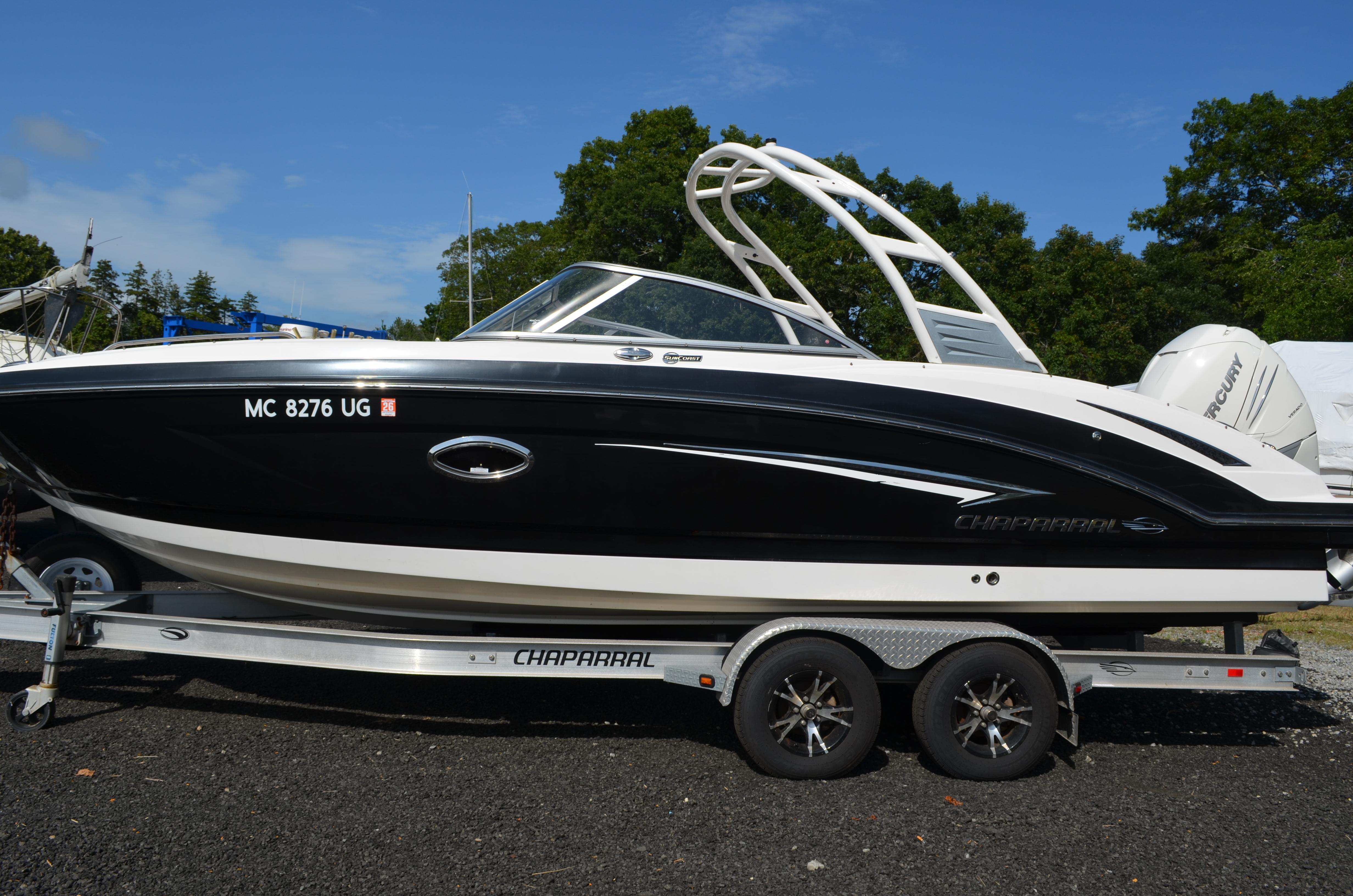 Chaparral 250 Suncoast 2018 Chaparral 250 Suncoast boat on trailer, black and white design, parked outdoors.