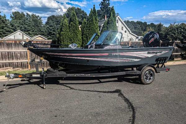 Ranger VS1682SC Angler 2024 Ranger VS1682SC Angler boat on trailer, parked on residential street.