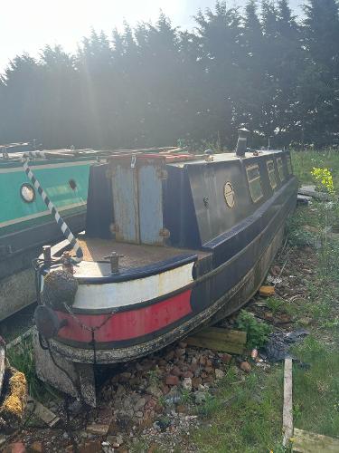 Narrowboat Cruiser Stern 'LADY SEER' 1984 Narrowboat Cruiser Stern "LADY SEER" docked on grassy area, surrounded by trees.