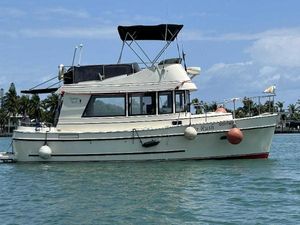 Camano Troll 2005 Camano Troll boat on water, featuring a white hull and black canopy.