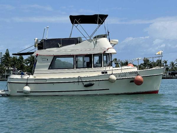 Camano Troll 2005 Camano Troll boat on water, featuring a white hull and black canopy.