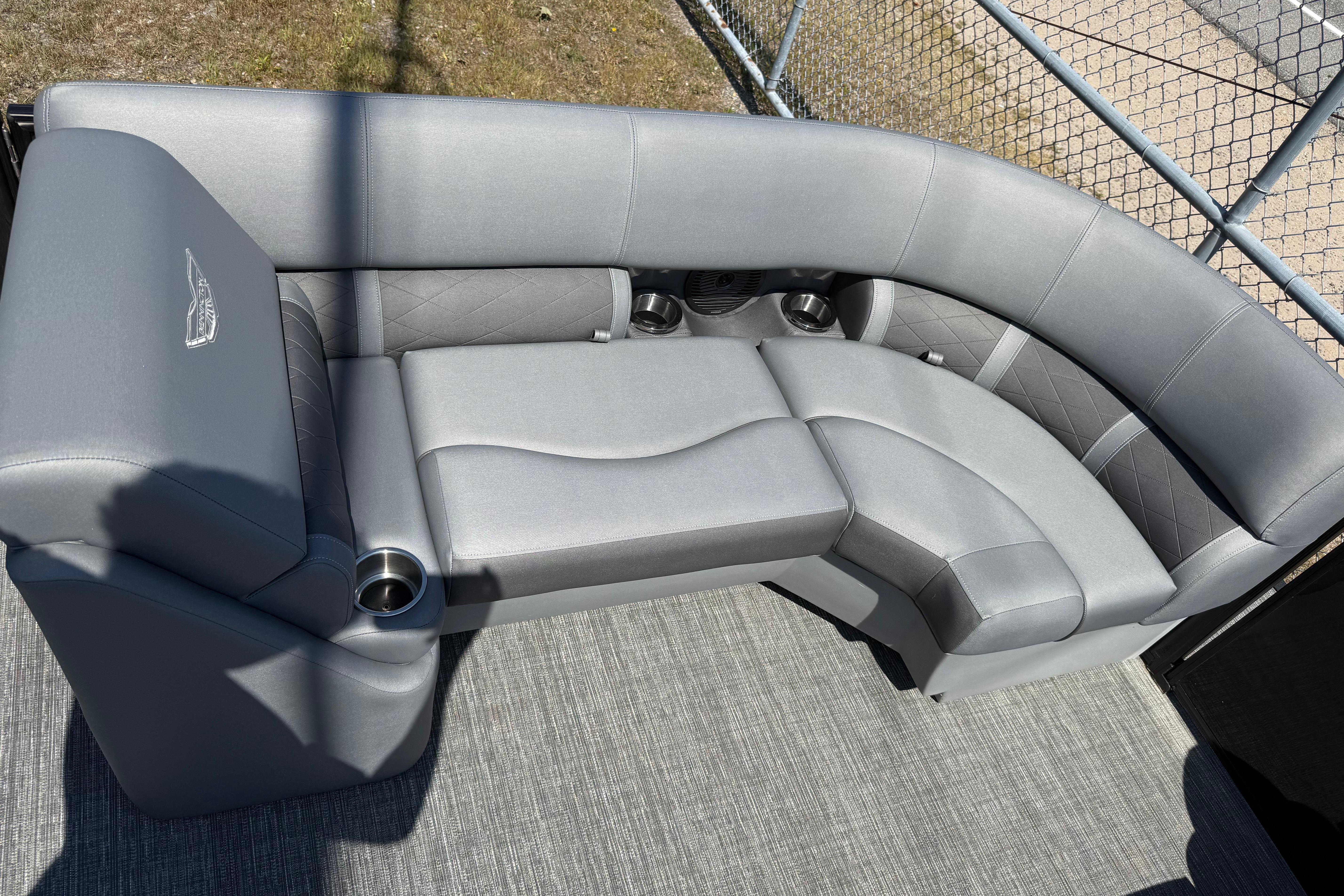 Bennington 23LSB 2024 Bennington 23LSB boat interior with luxurious gray seating and cup holders.