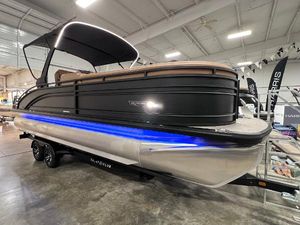 Harris Solstice 250 2025 Harris Solstice 250 pontoon boat with blue LED lights in showroom.