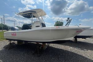 Pioneer 222 Sportfish 2011 Pioneer 222 Sportfish boat for sale, displayed outdoors on gravel.