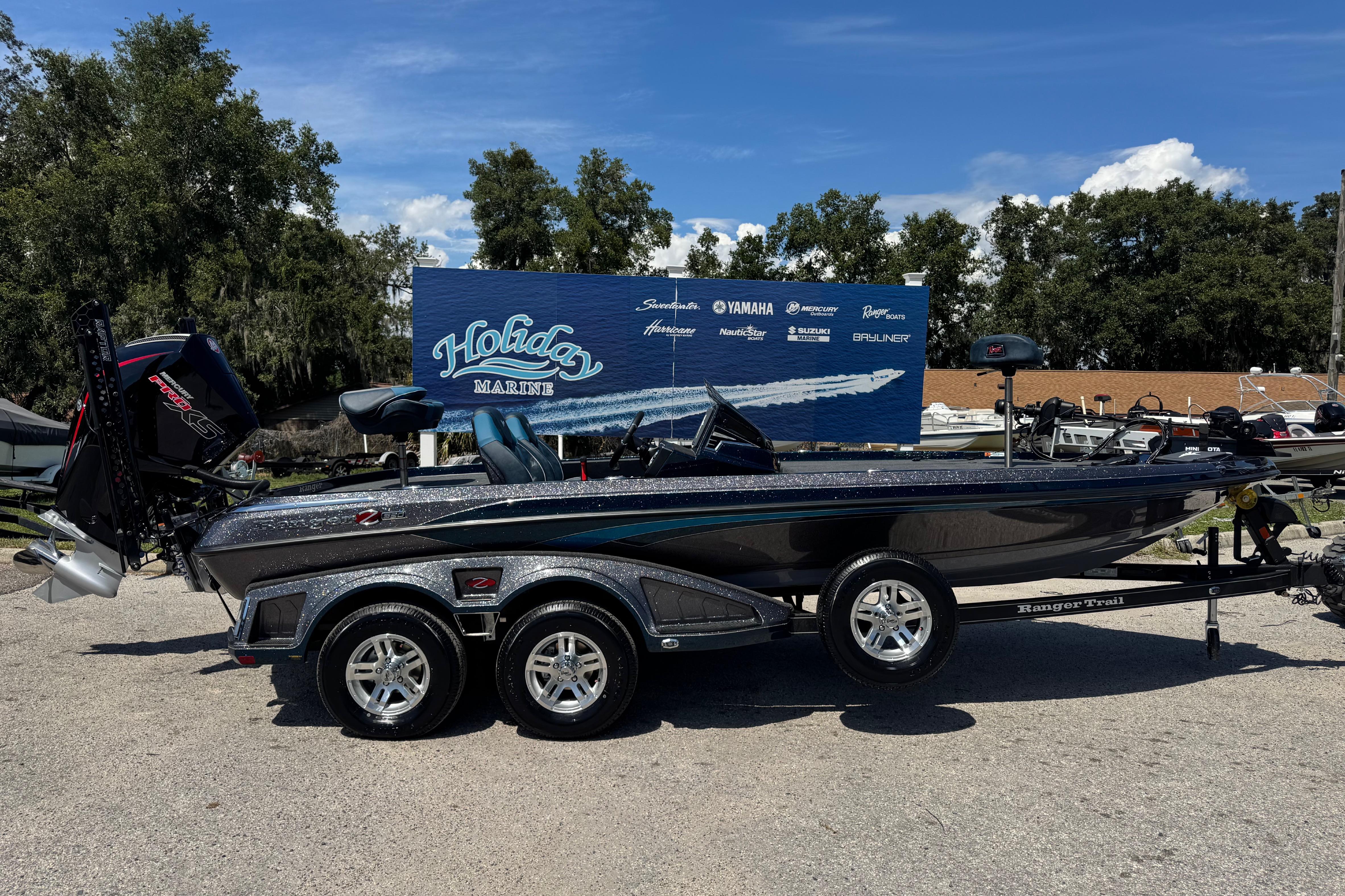 Ranger Z520 2026 Ranger Z520 boat on trailer at Holiday Marine dealership.